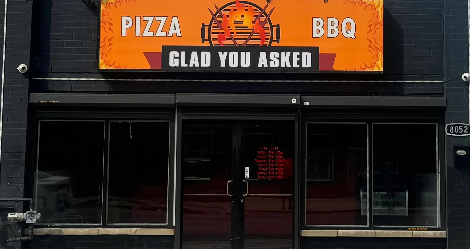 Exterior of Glad You Asked Pizza BBQ restaurant