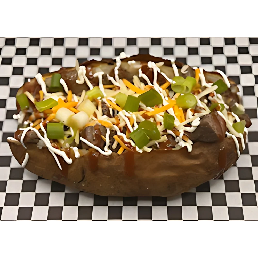 A loaded backed potato with sour cream