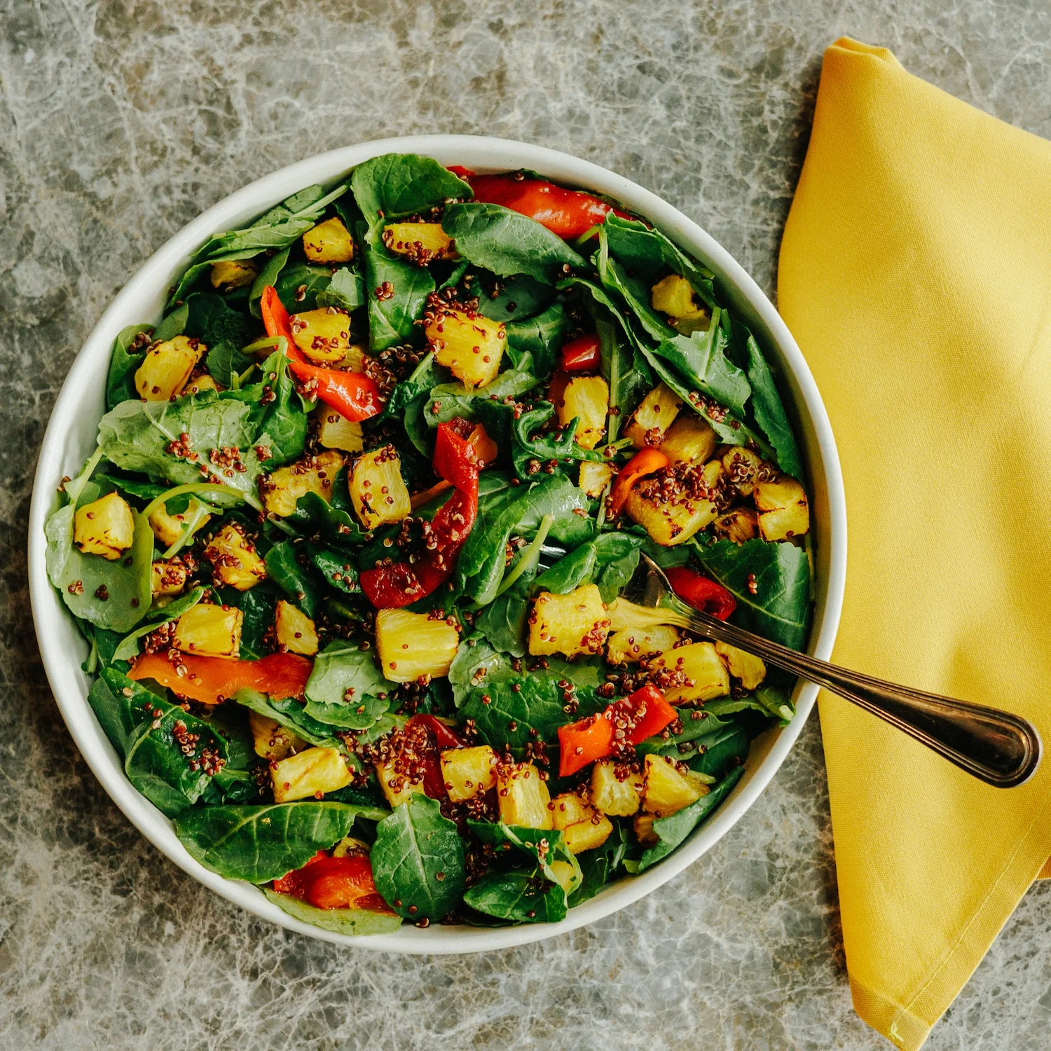 Tropical spinach salad with pineapple and red peppers