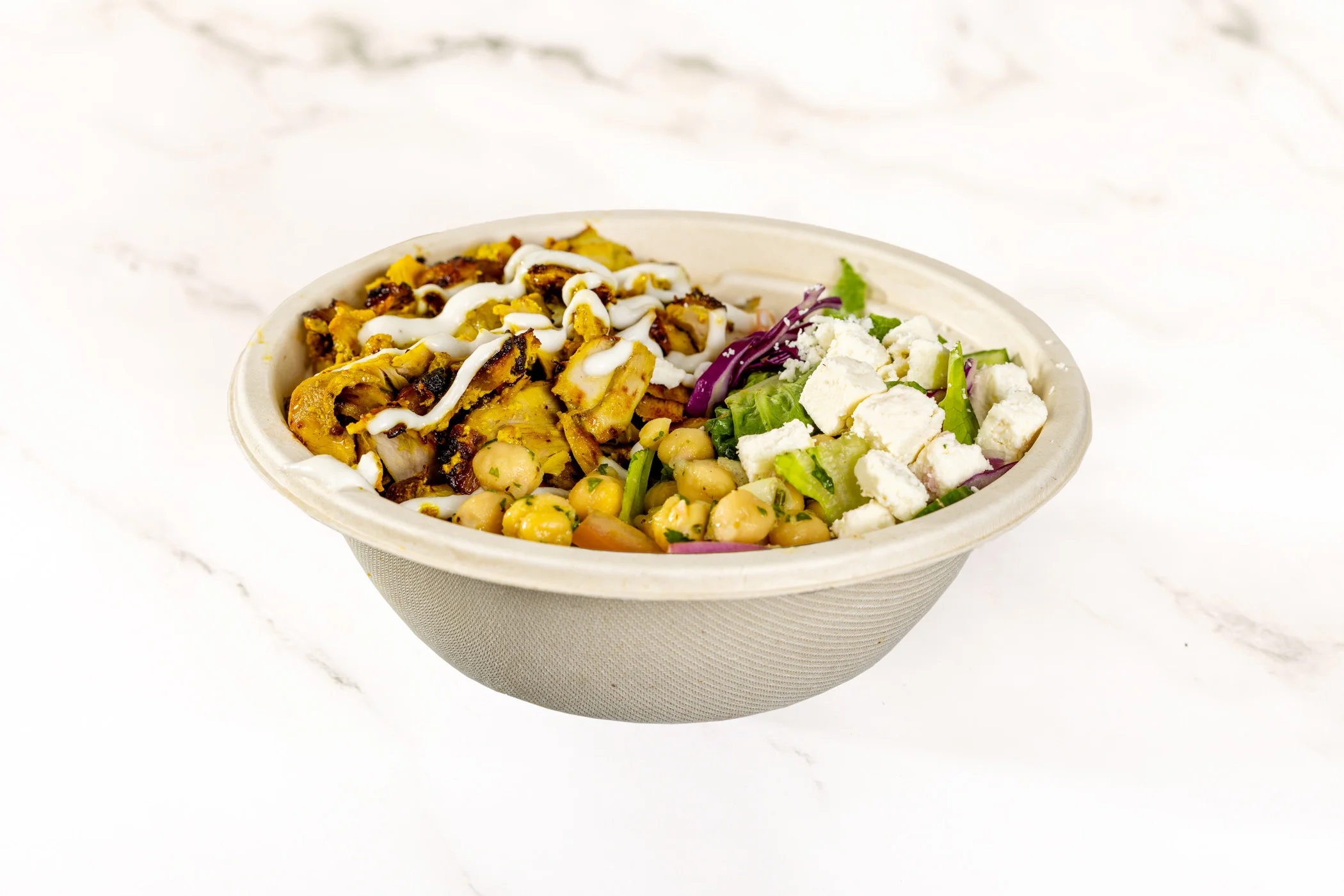 Delicious falafel wrap filled with fresh vegetables and sauces.