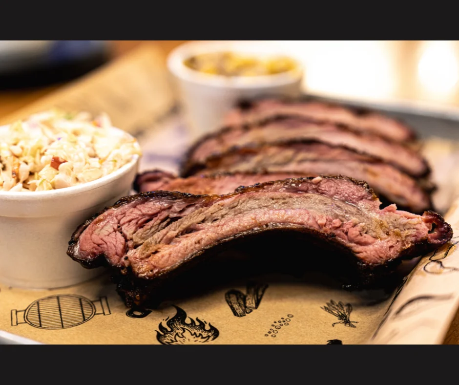 Smoked brisket served with coleslaw and sides