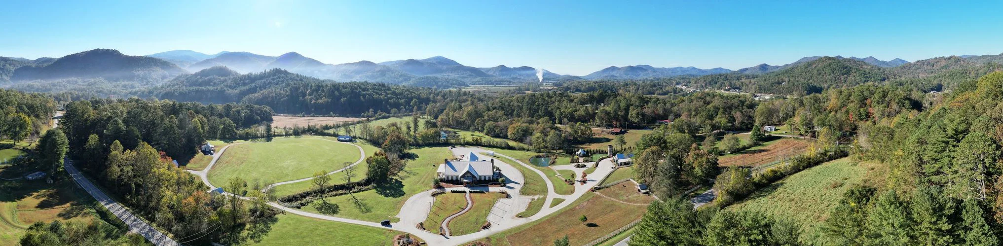 Scenic mountain view with lush greenery and clear blue skies