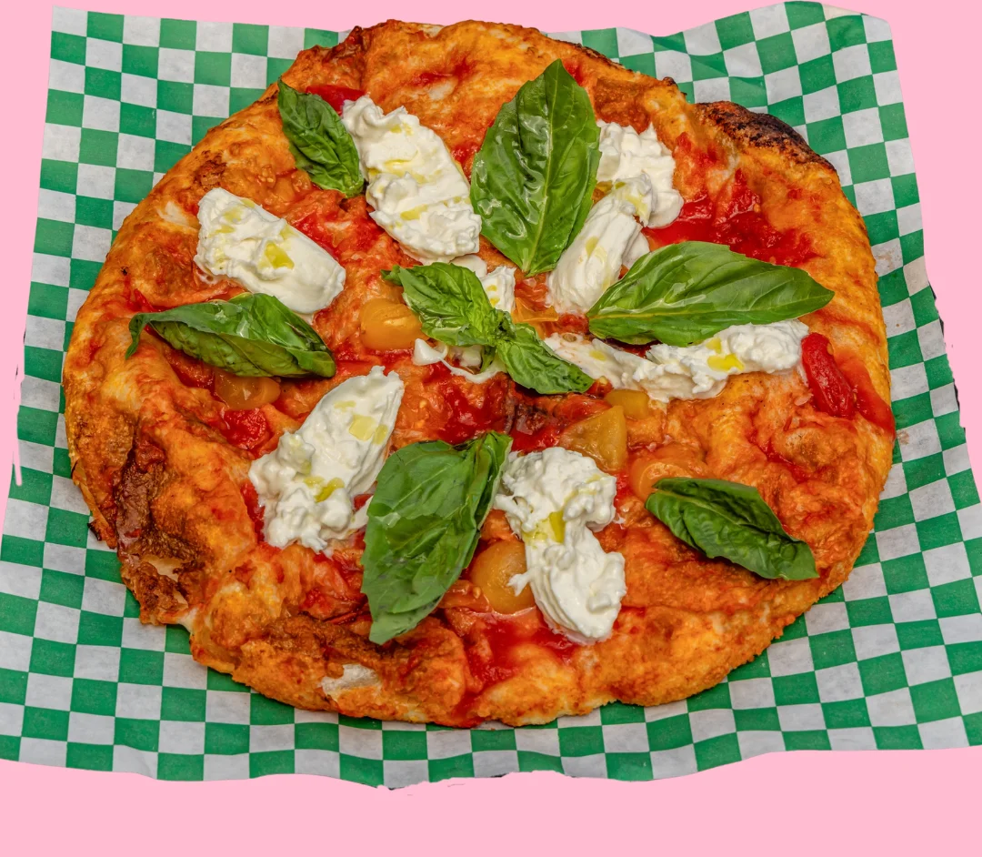 Margherita pizza with fresh basil and creamy mozzarella