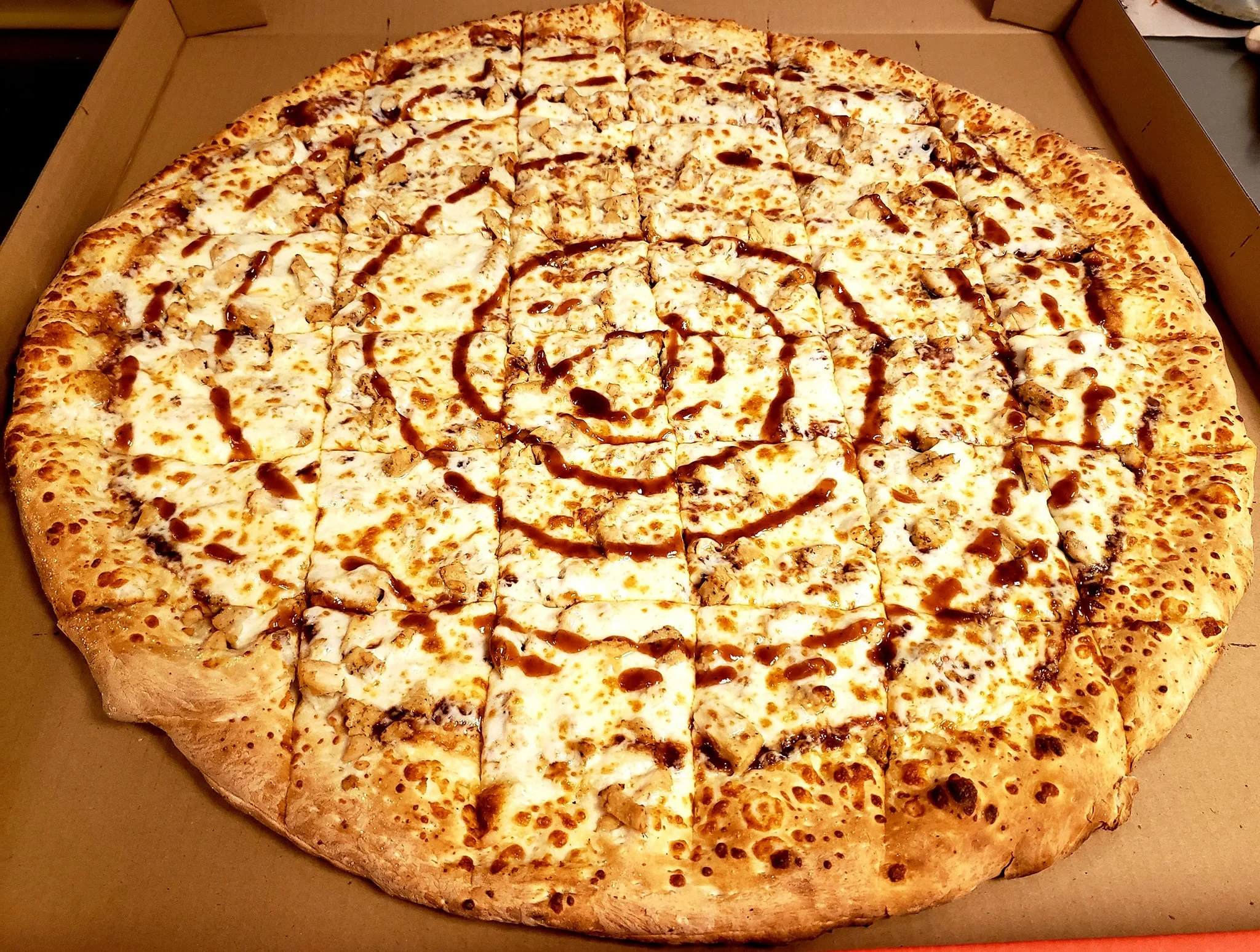 BBQ chicken pizza with cheese and sauce