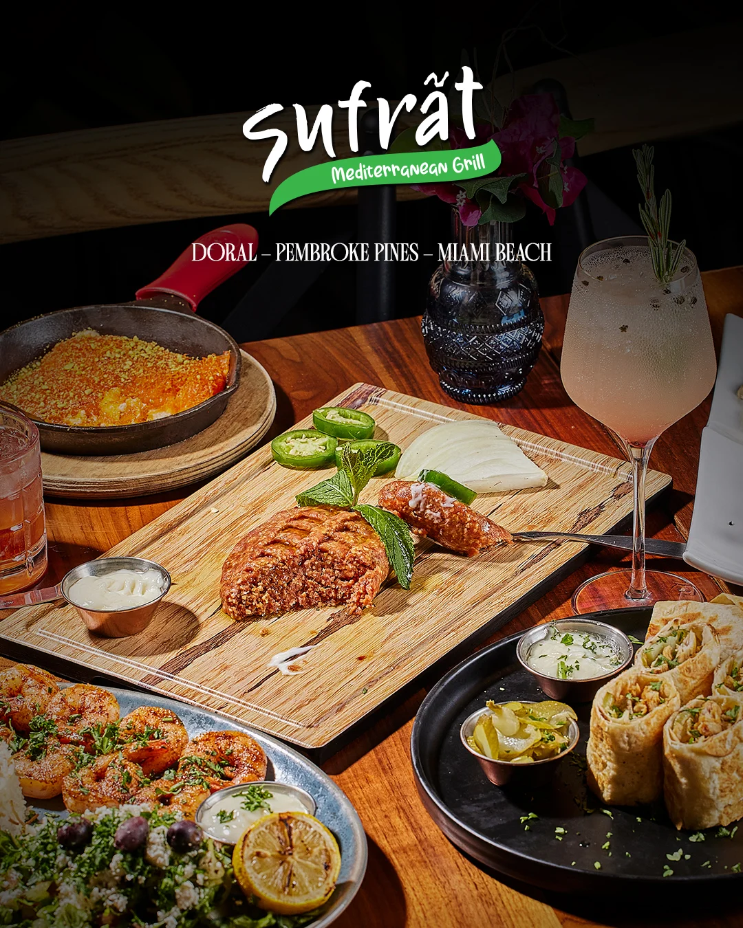 Mediterranean dishes at Sufrat Grill, including kebabs, wraps, and fresh sides.