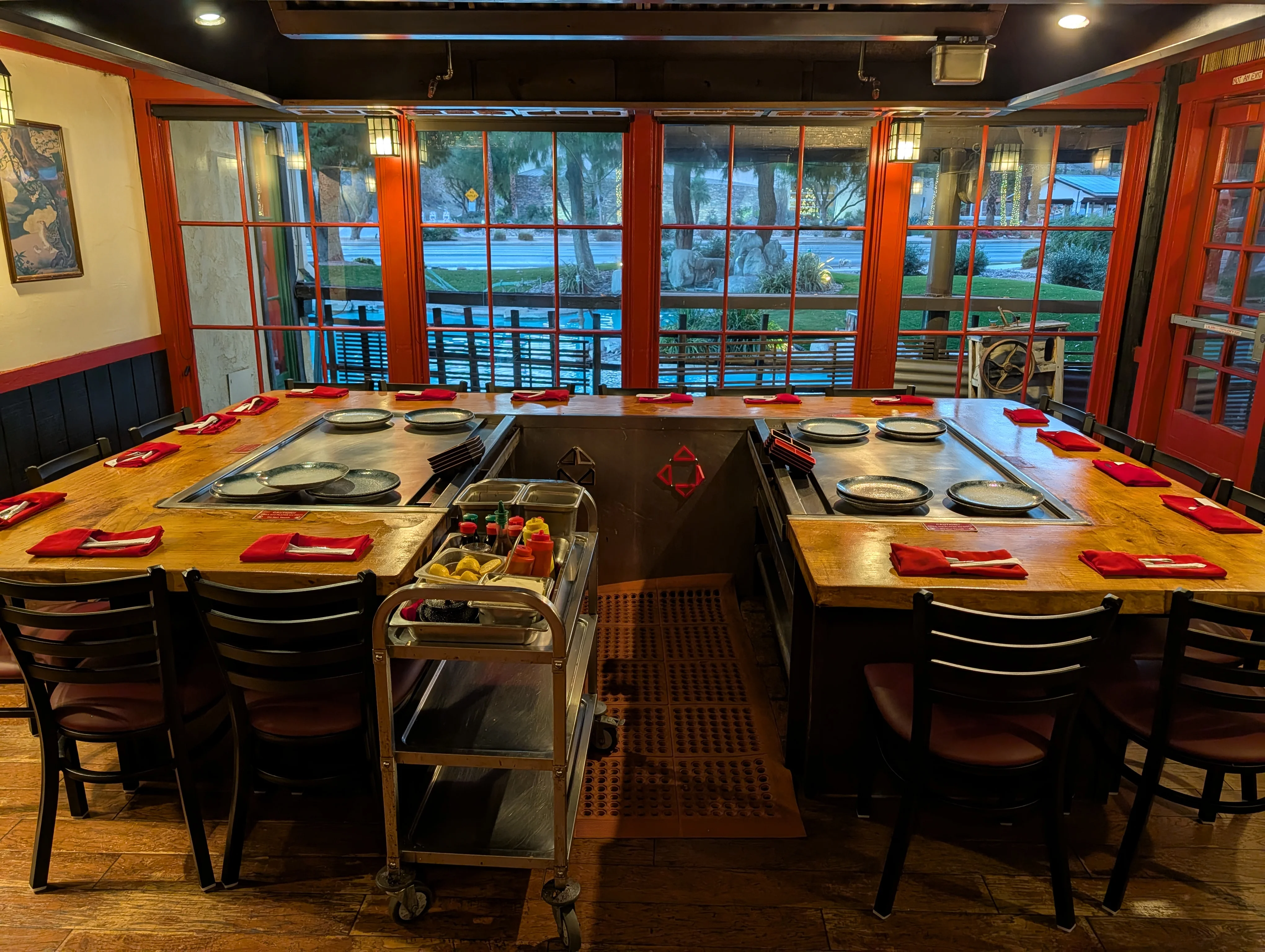 Cozy Japanese teppanyaki restaurant interior with grill tables
