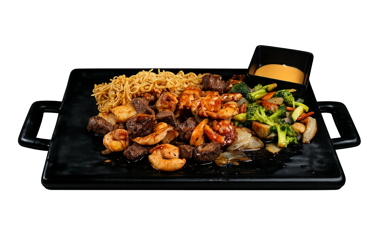 Sizzling hibachi platter with steak, shrimp, and vegetables