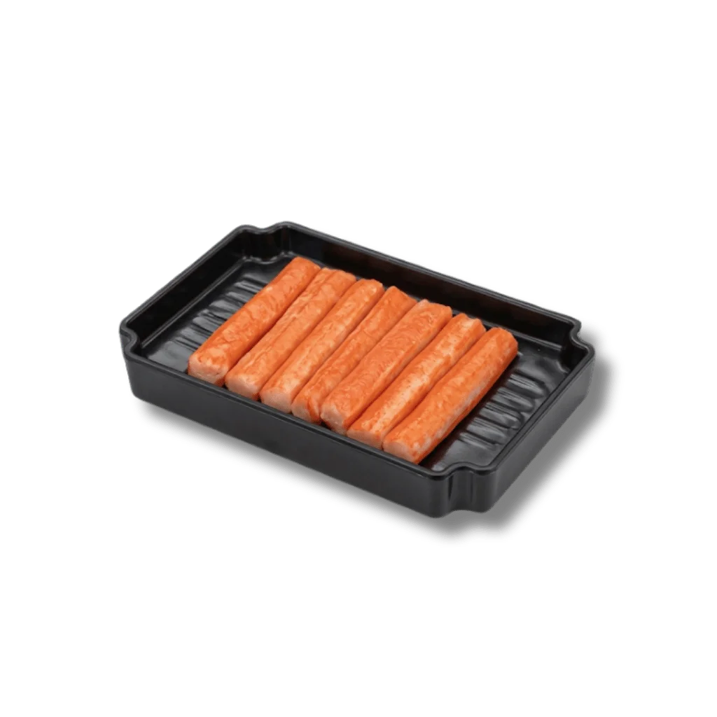 A black tray with eight orange crab sticks arranged neatly.
