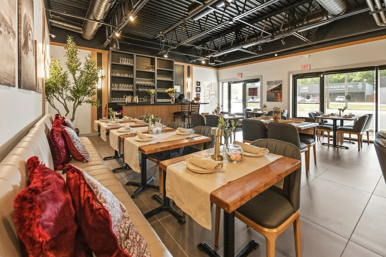 Interior of a modern restaurant with elegant seating and decor.