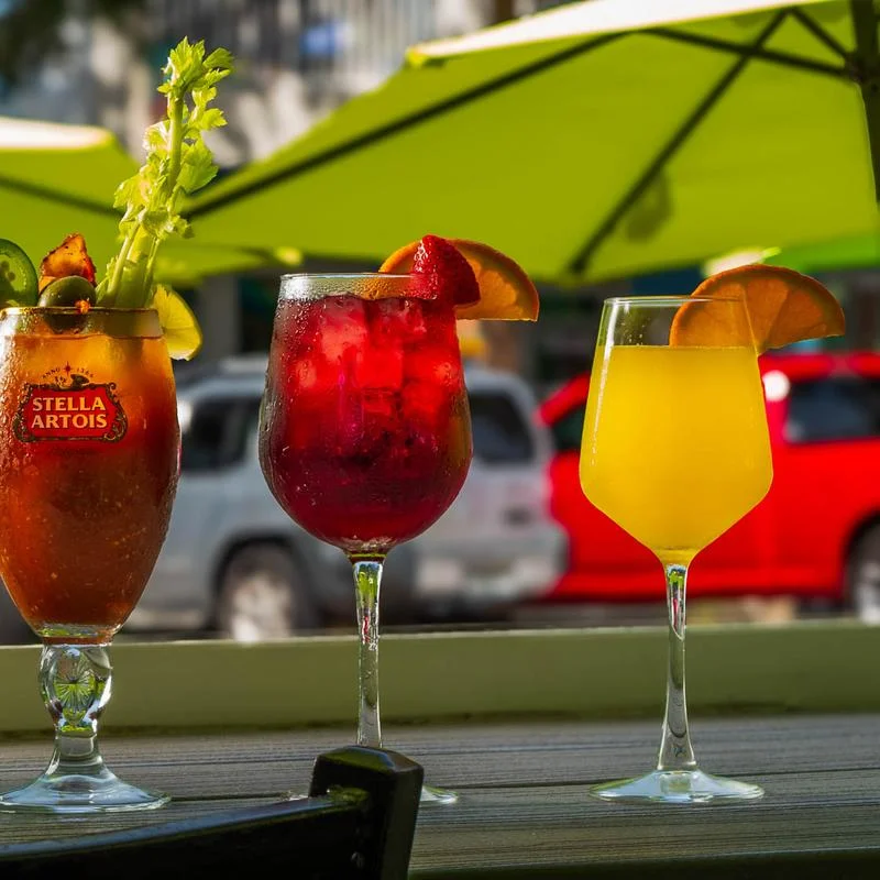 Colorful fruit cocktails served outdoors on a restaurant patio