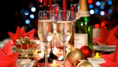 Festive holiday dining table with champagne and decorations