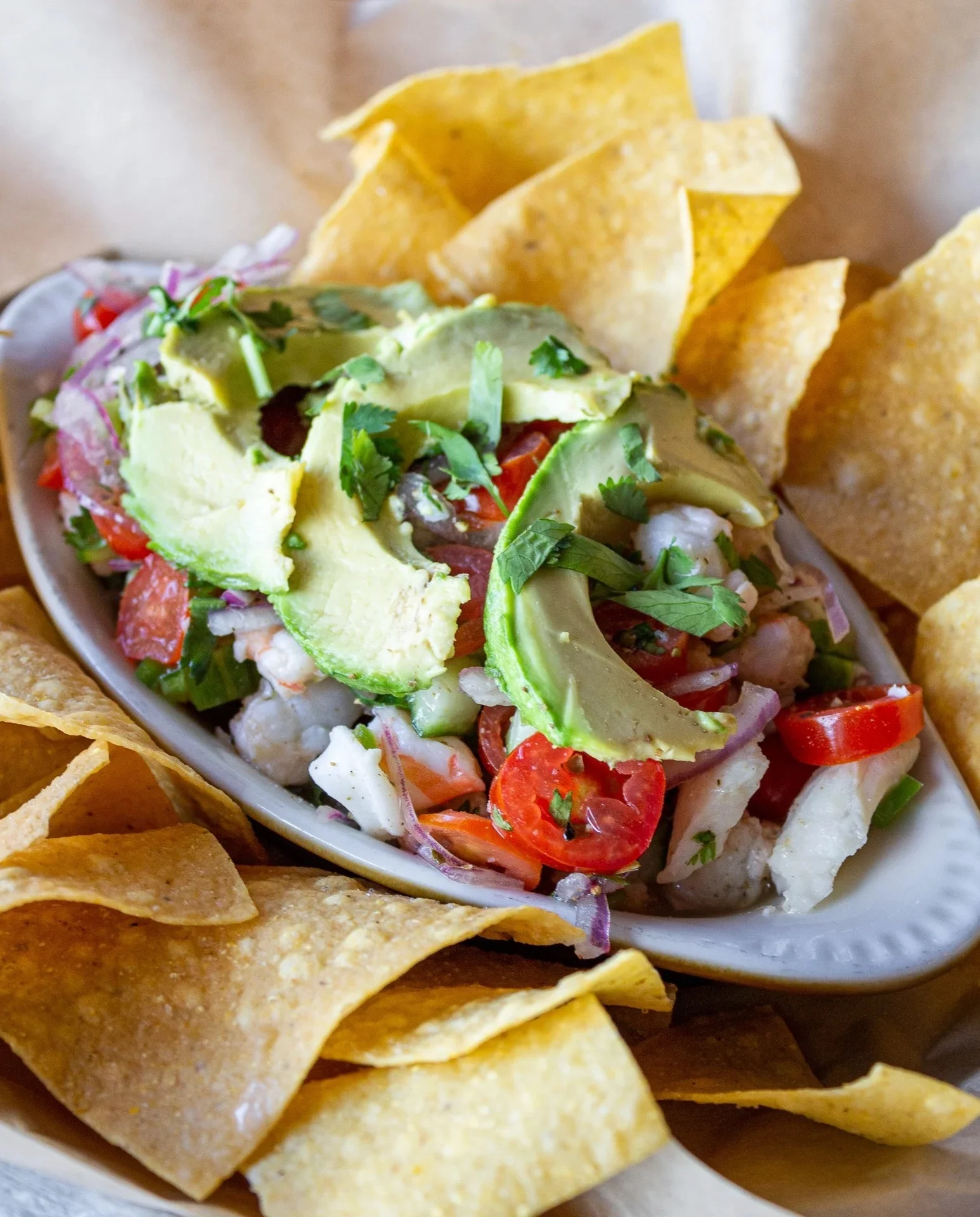 Fresh ceviche with avocado served with tortilla chips