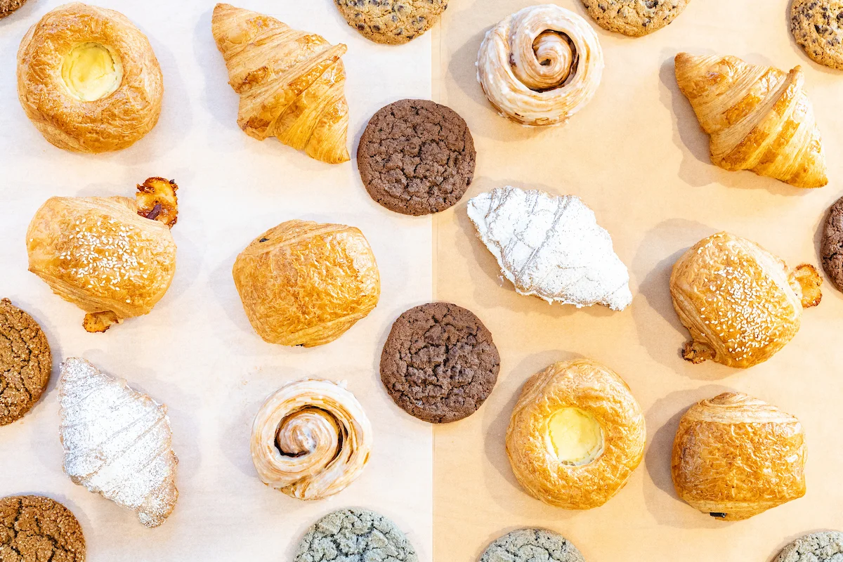 Assorted French pastries and cookies on parchment paper