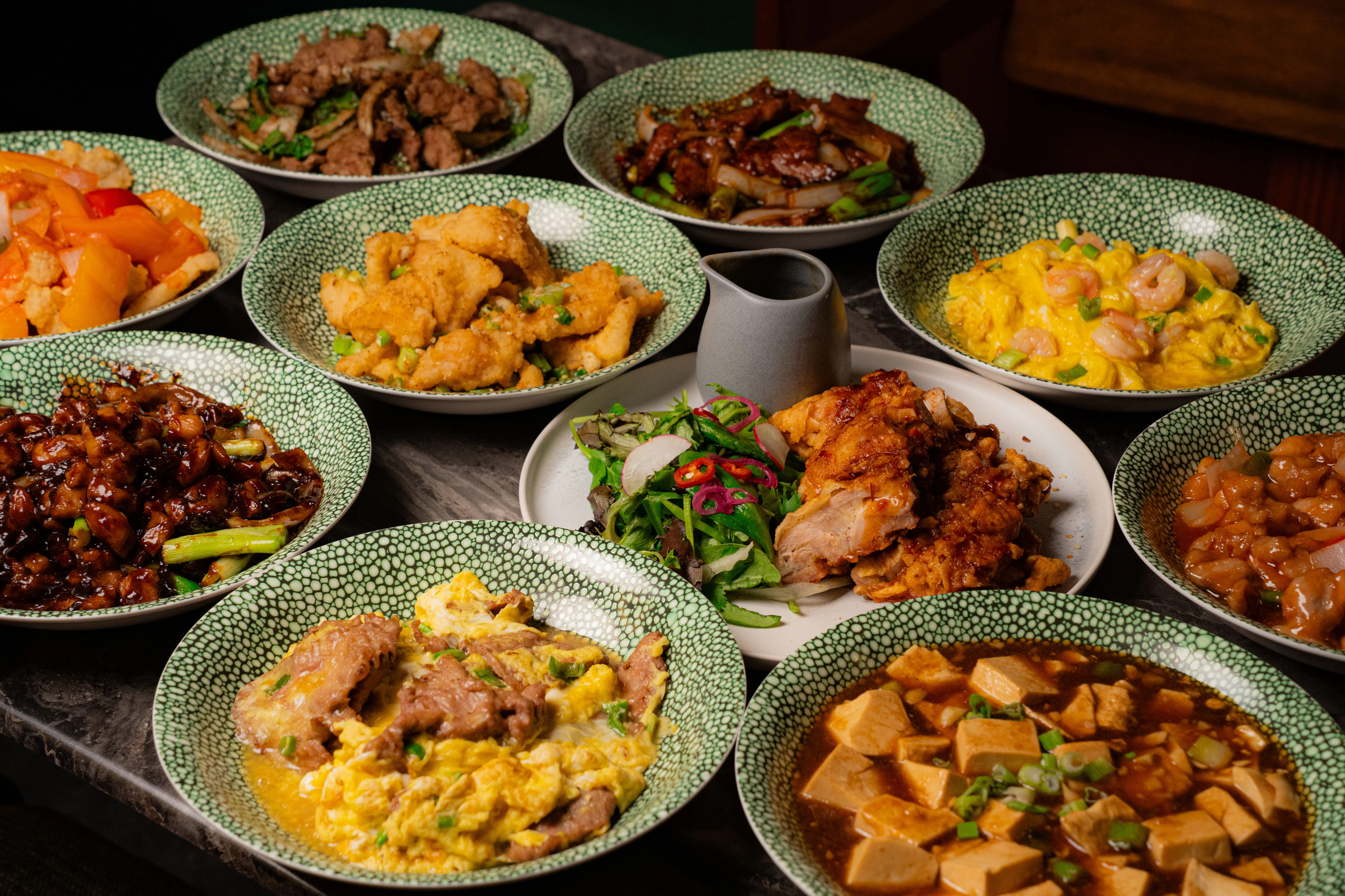 Delicious Chinese dishes beautifully arranged on a table.