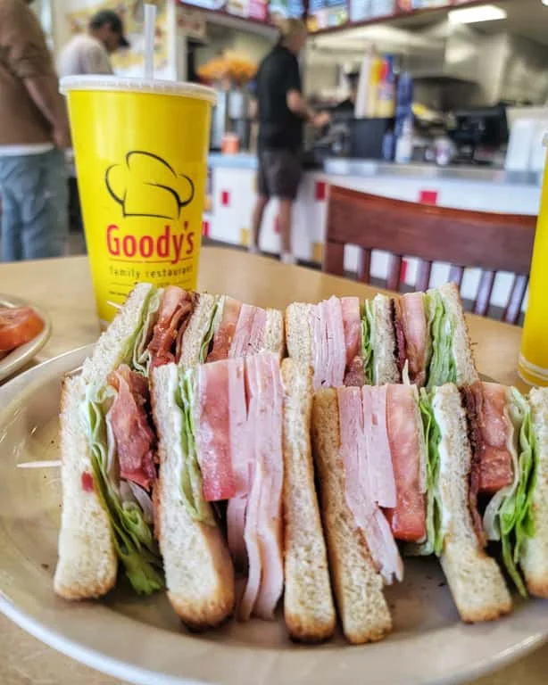 Classic club sandwich served with lettuce and tomato
