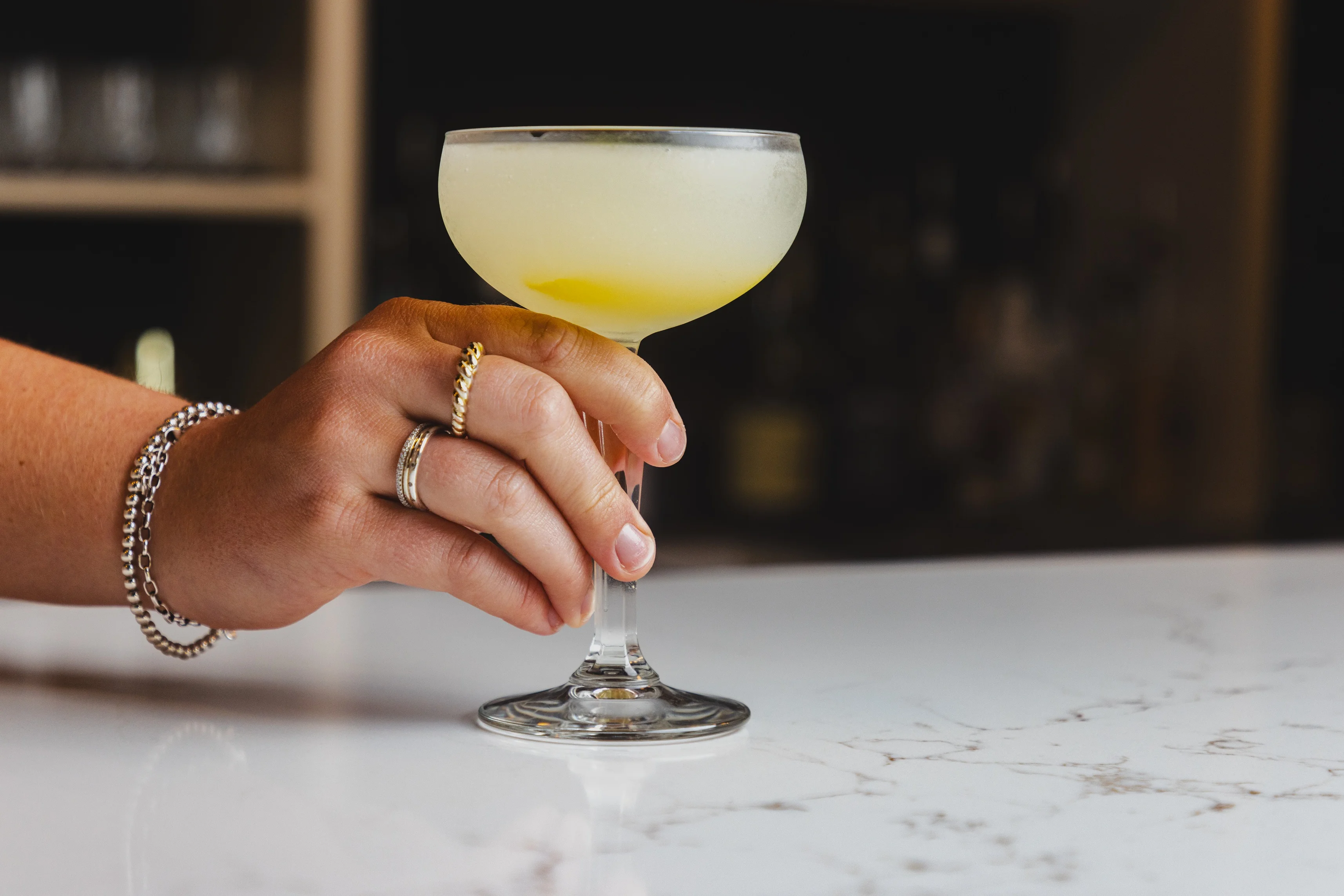 Classic cocktail served in a coupe glass with a lemon twist