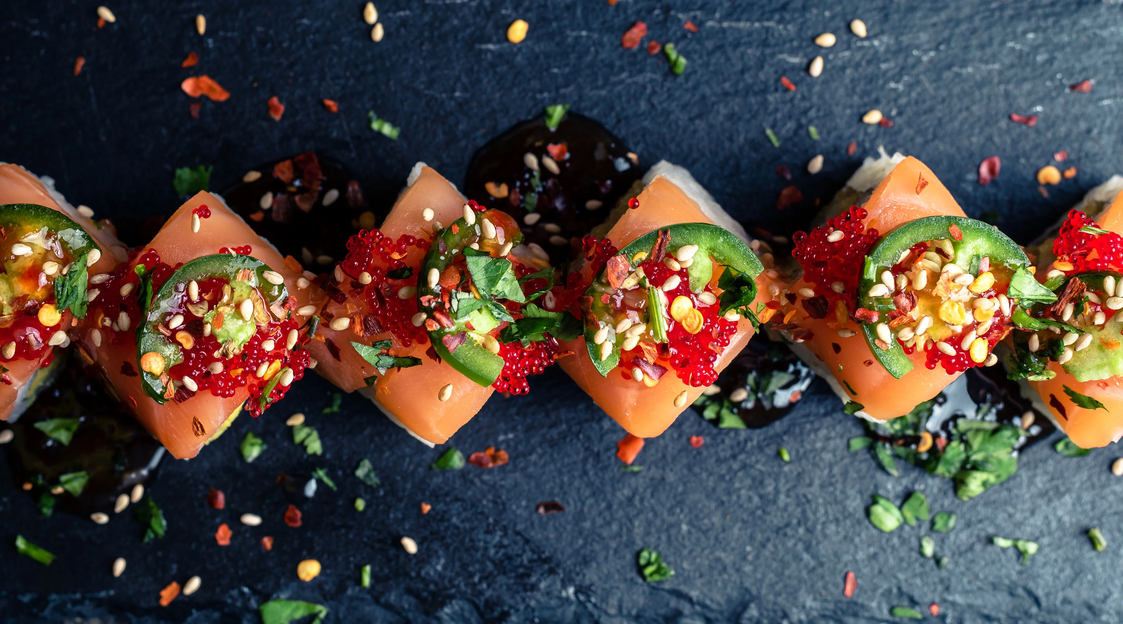 Artistic sushi roll with vibrant toppings