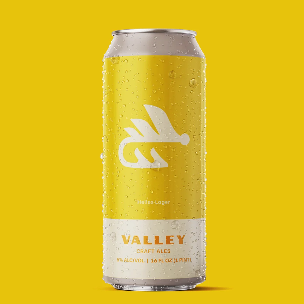 Helles lager beer can from Valley Craft Ales on a bright yellow background