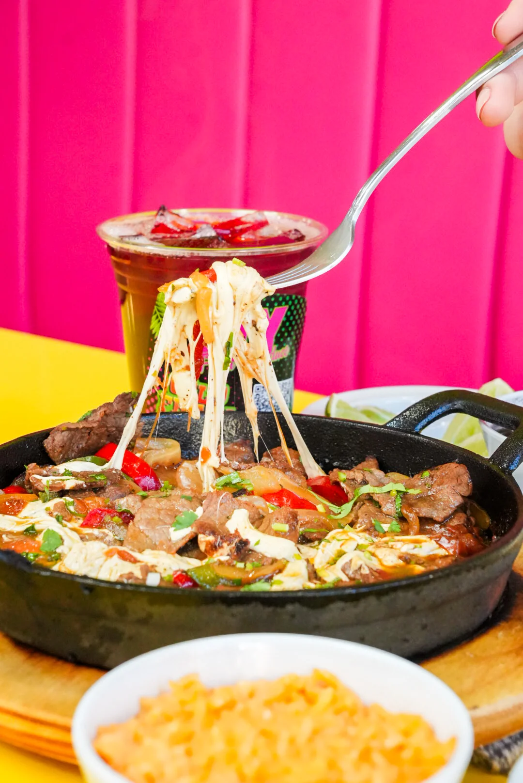Sizzling fajitas served in a cast iron skillet