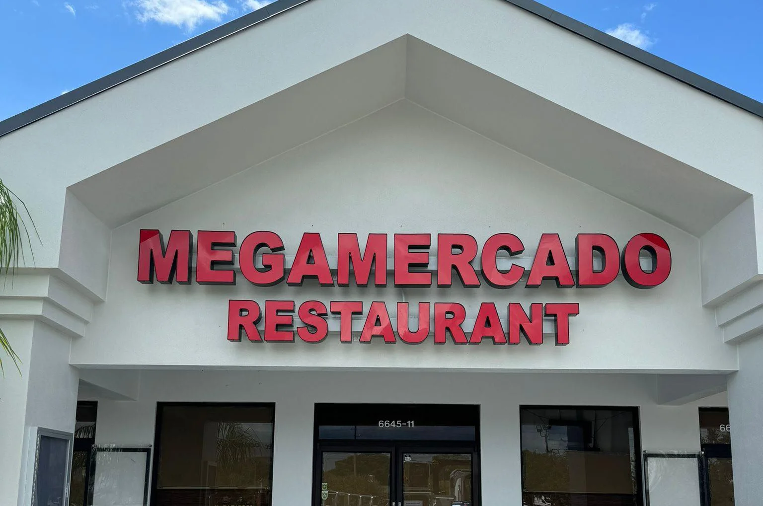 Exterior view of Megamercado Restaurant with bold signage
