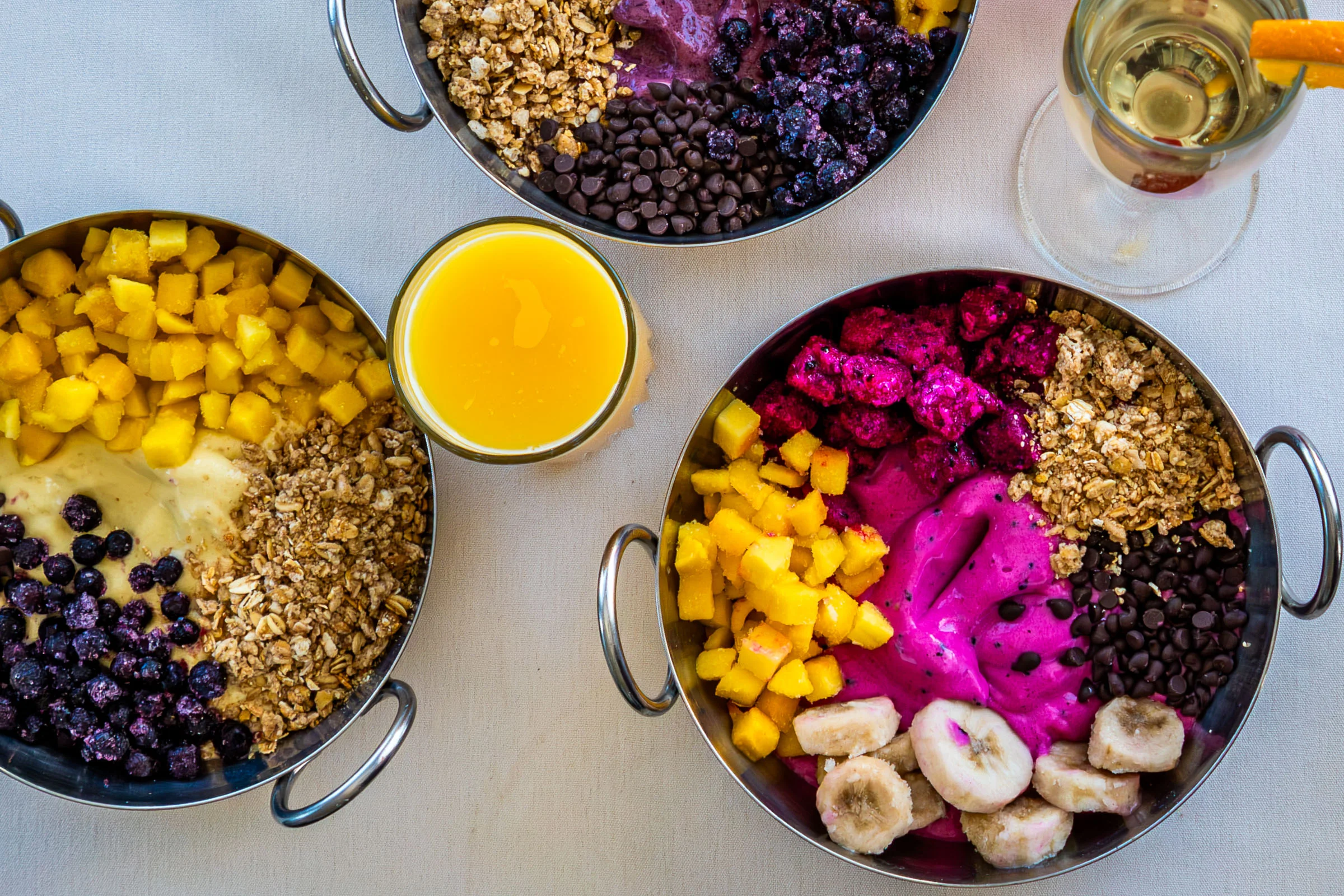 Colorful smoothie bowls with tropical fruits
