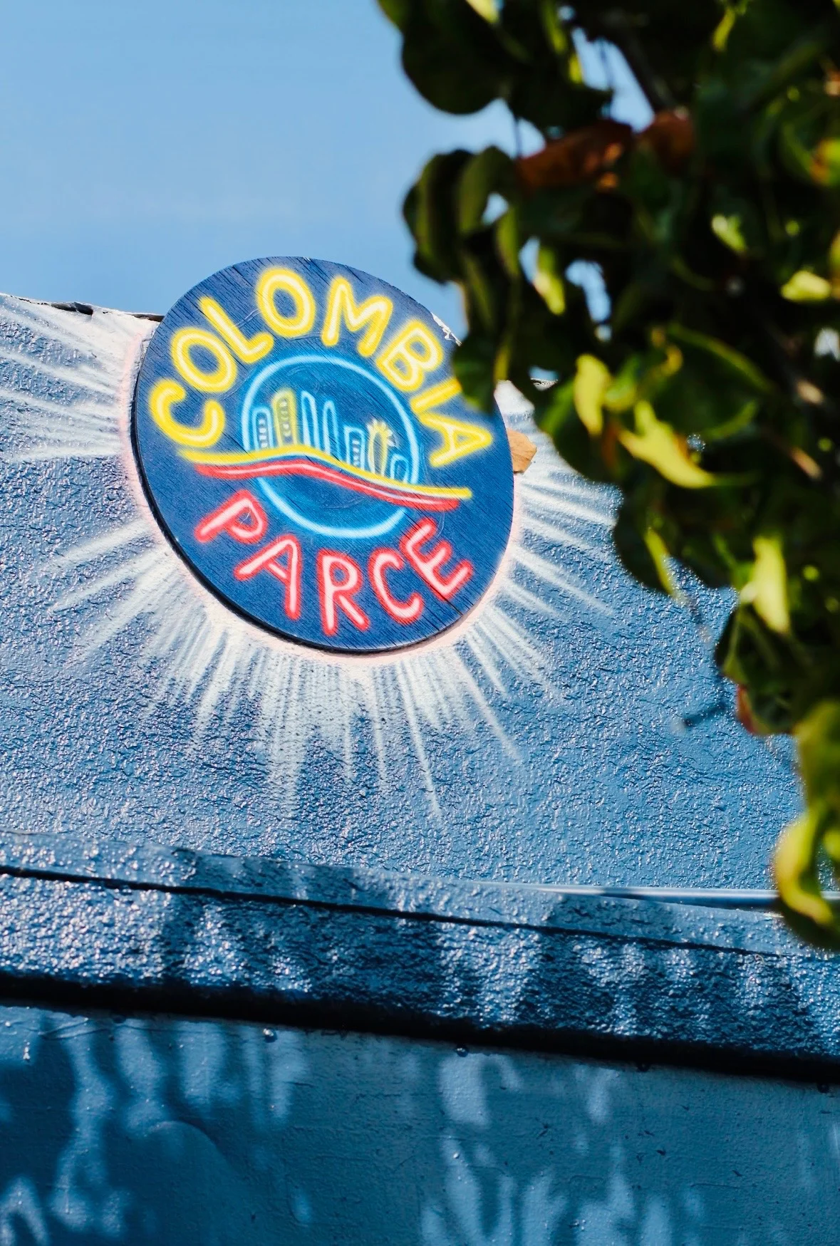 Colorful sign for Colombian restaurant 'Parce' with vibrant design