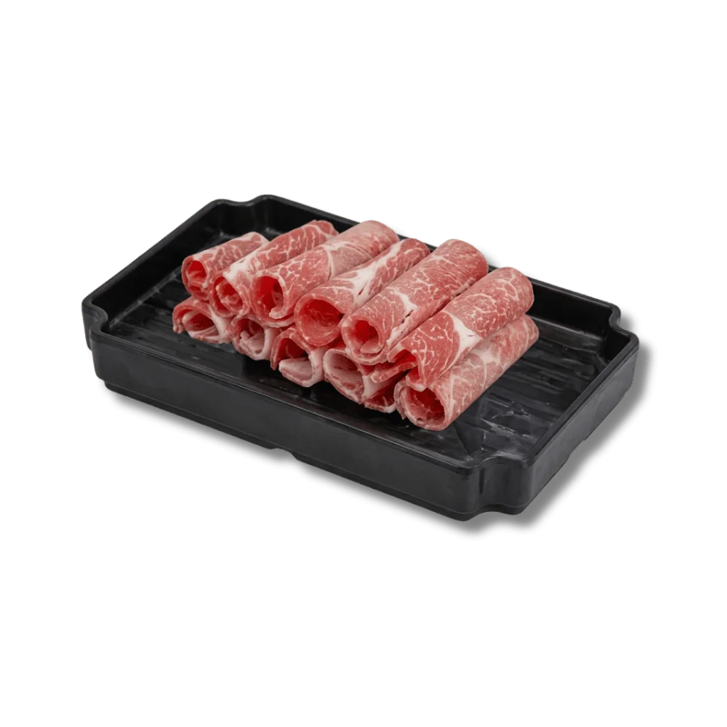 Thinly sliced beef rolls arranged on a black tray.