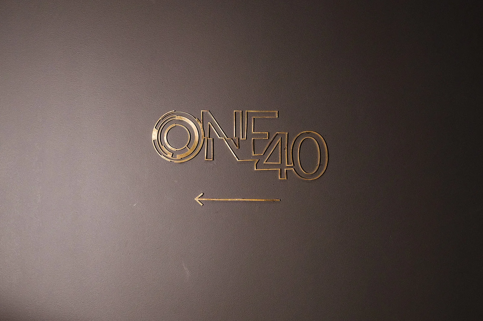 Stylish restaurant sign for ONE40 with modern design