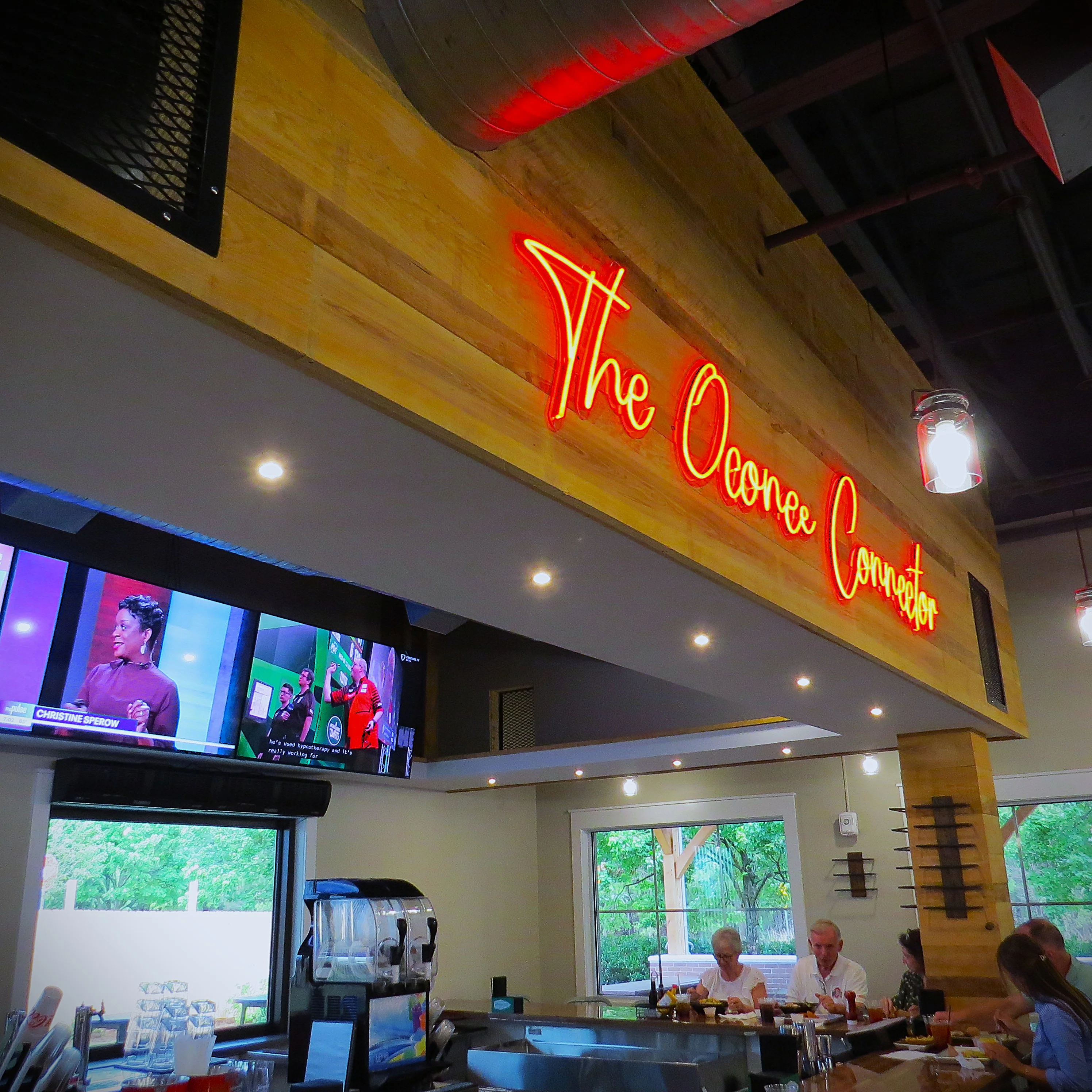 Cozy restaurant interior with modern decor and neon signage