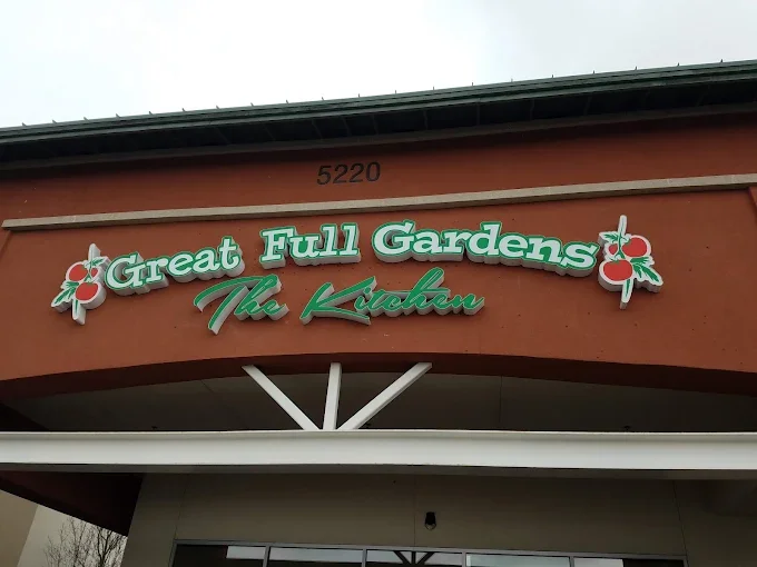 Great Full Gardens cafe eatery logo with tomato and garden illustrations
