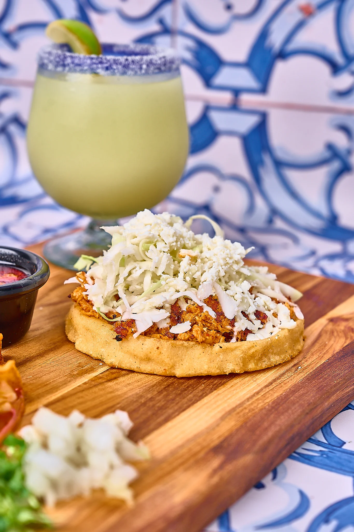 Delicious Mexican tostada topped with cabbage and cheese