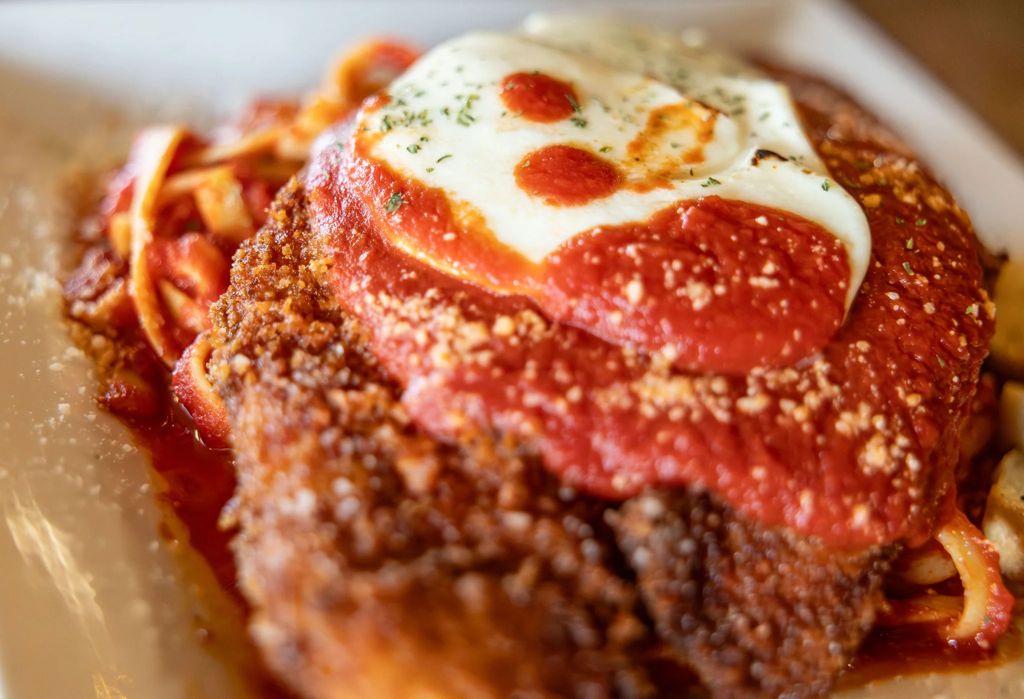 Classic Italian chicken parmesan with marinara sauce