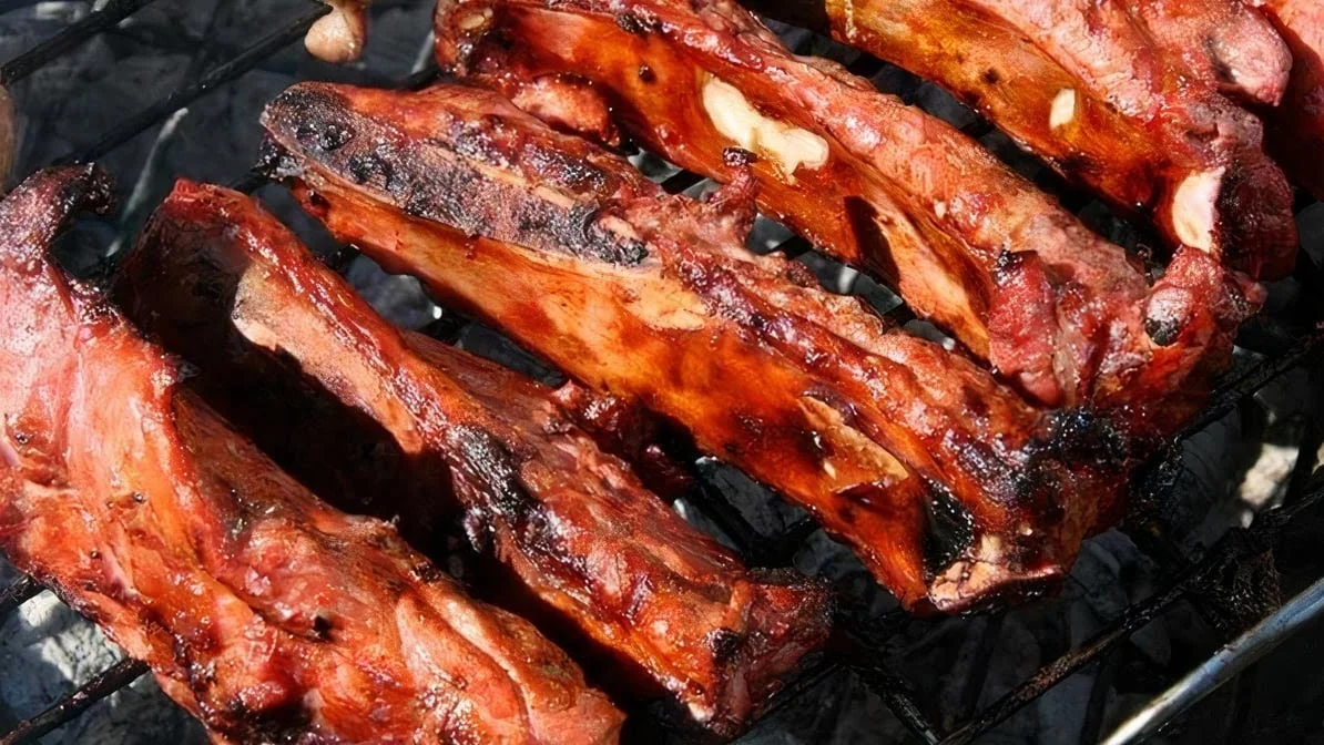 Grilled Brazilian barbecue ribs on a charcoal grill