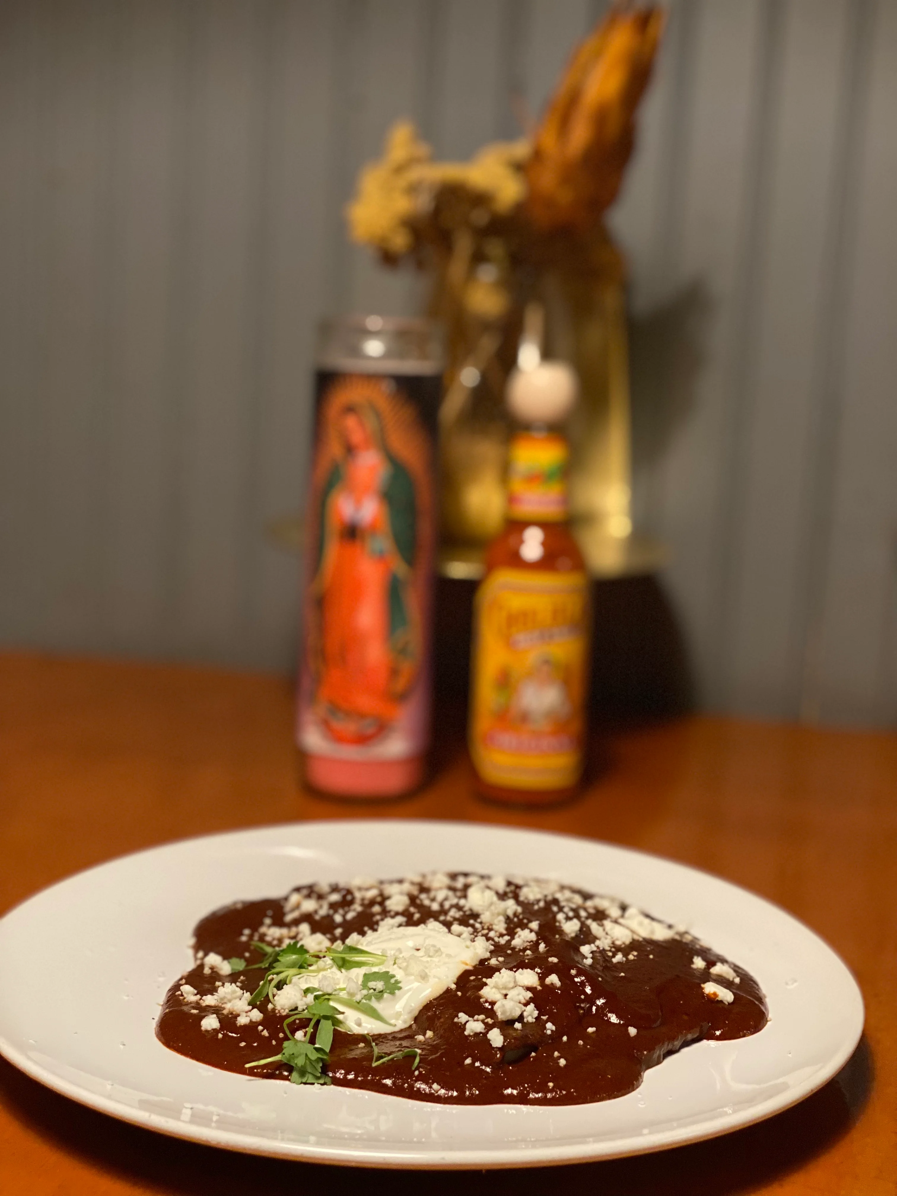 Authentic Mexican mole sauce with crema and cheese