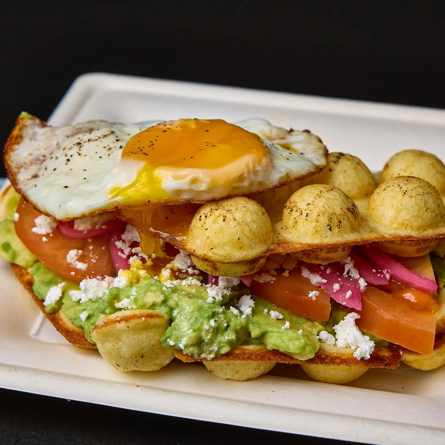 Mexican huevos rancheros with avocado and fried egg