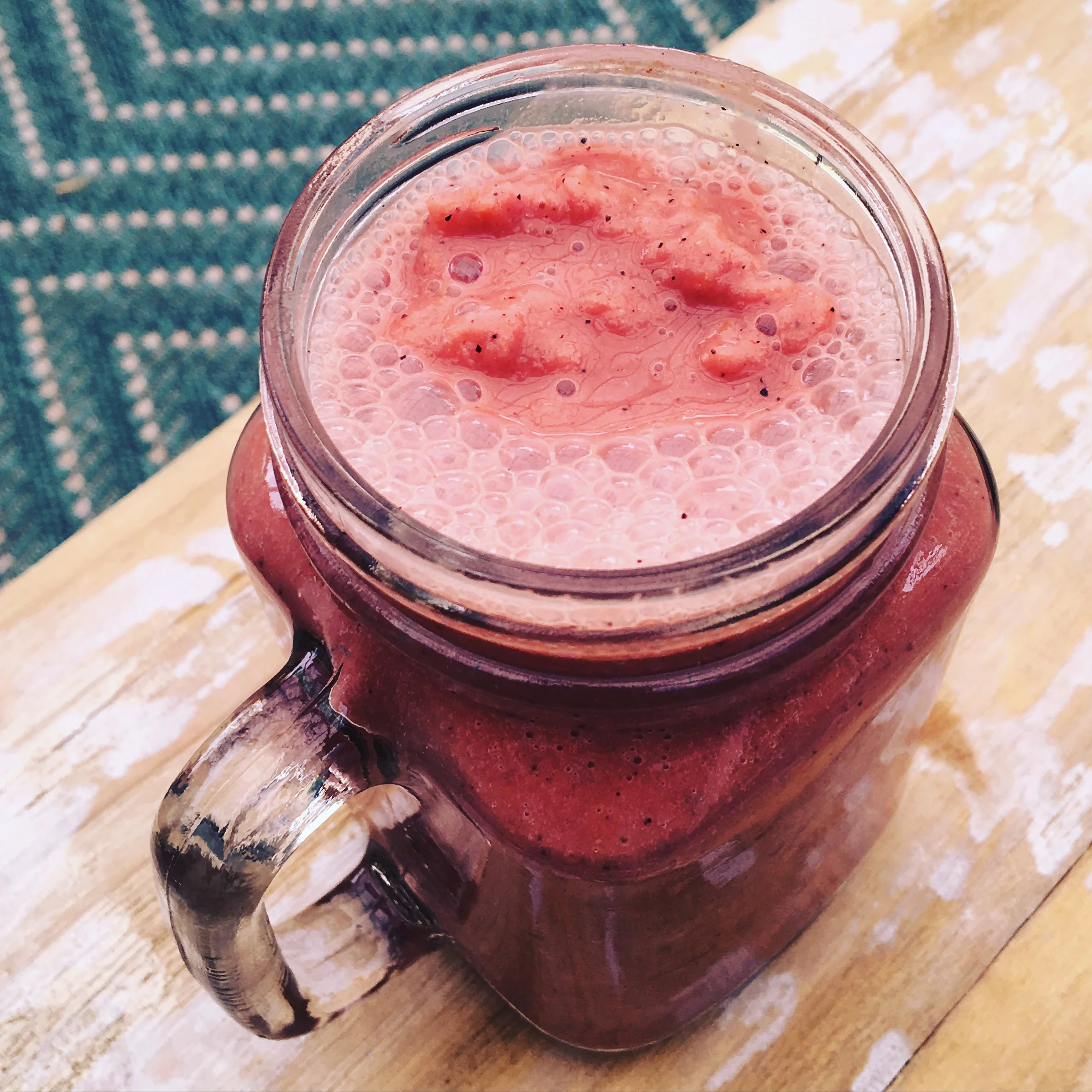 Refreshing strawberry smoothie in a mason jar
