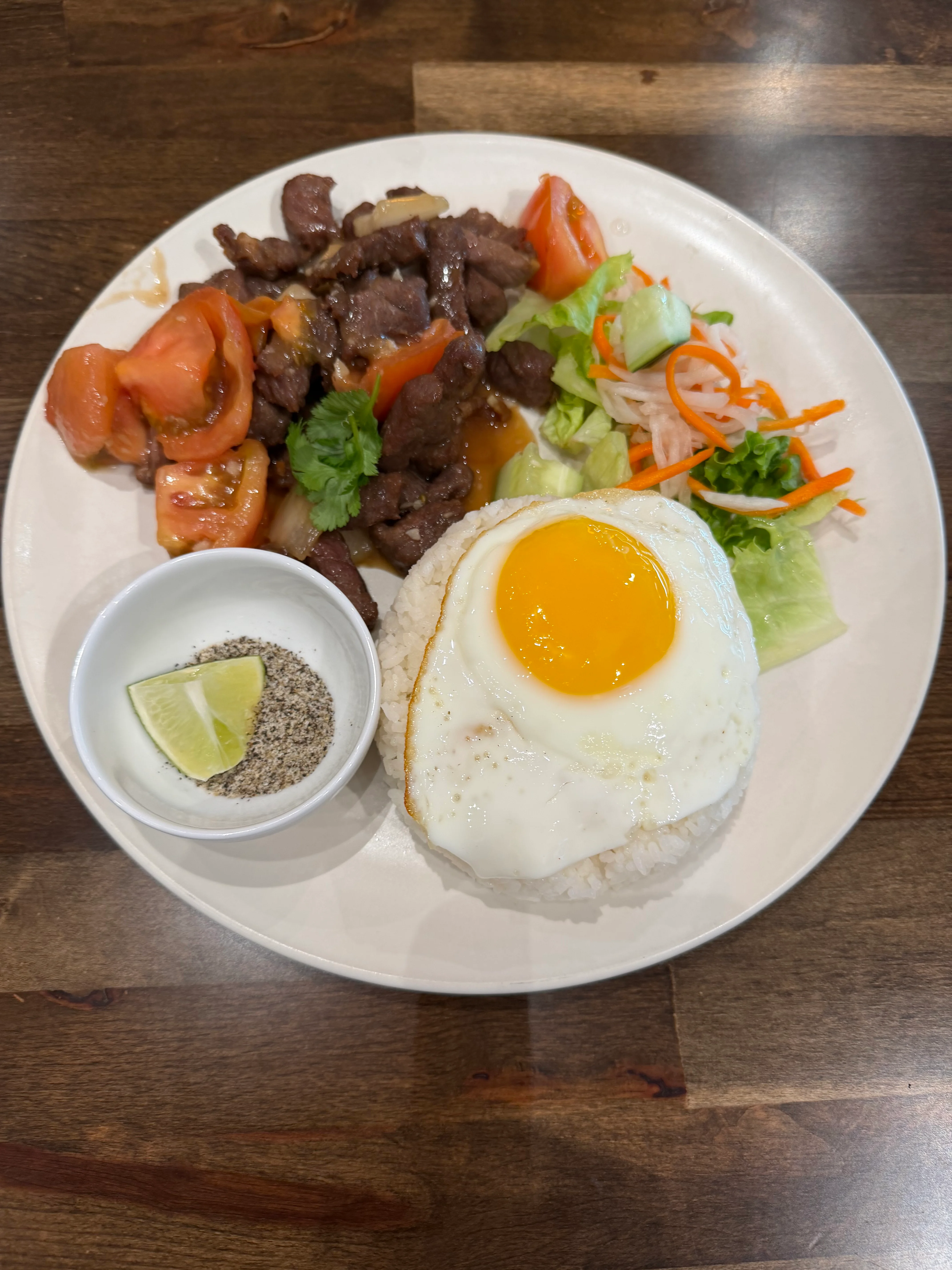 Vietnamese com tam with grilled beef and fried egg