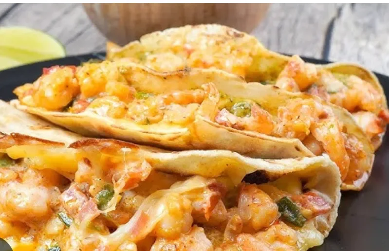 Shrimp quesadillas served on a black plate