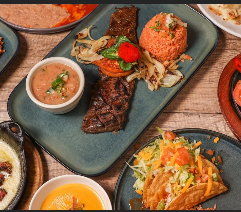 Mexican carne asada platter with rice and beans
