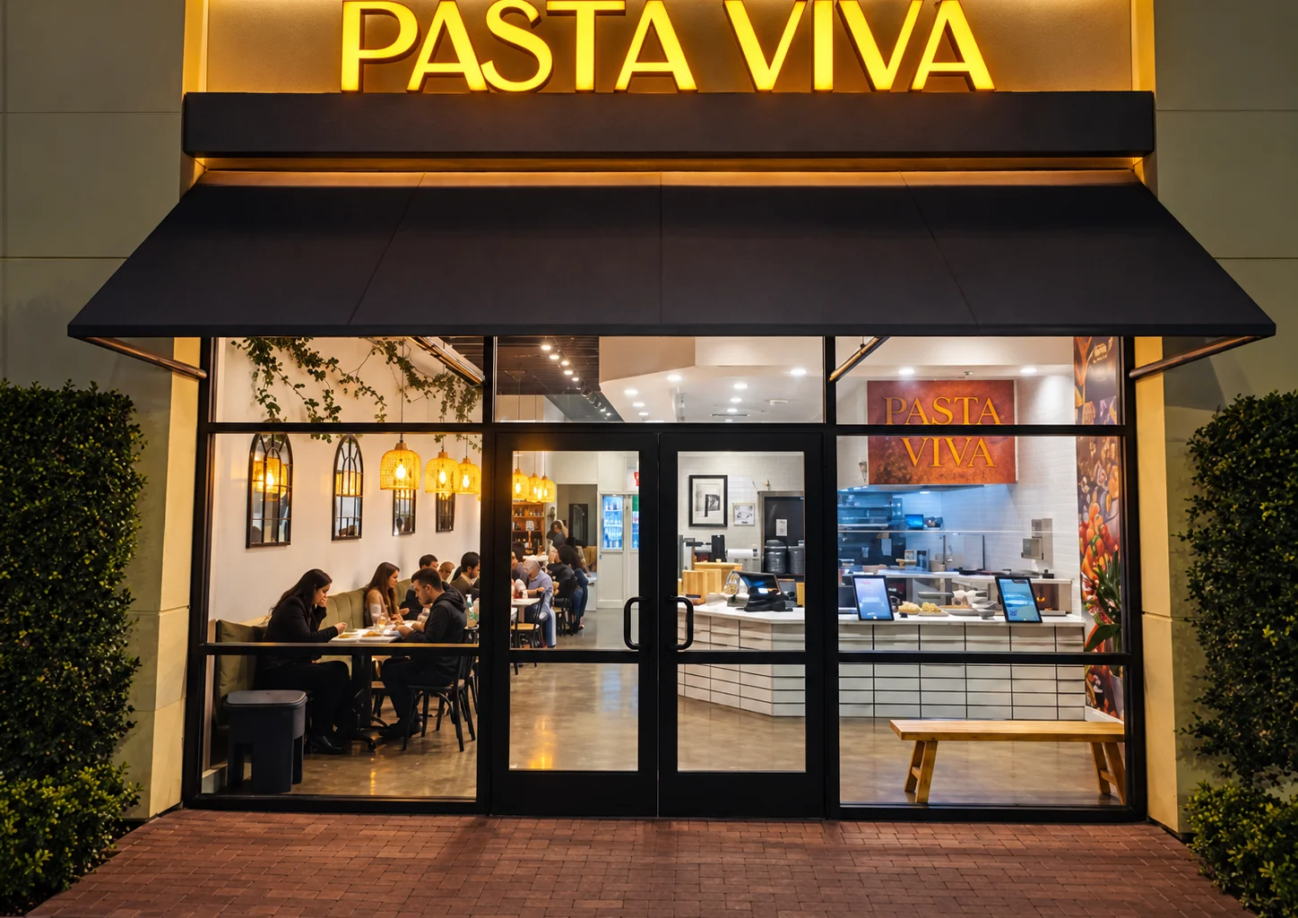 Freshly made fettuccine Alfredo being served in a restaurant kitchen