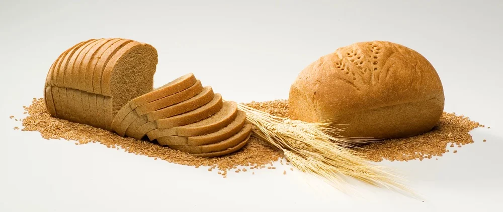 Delicious honey whole grain bread on a wooden table.