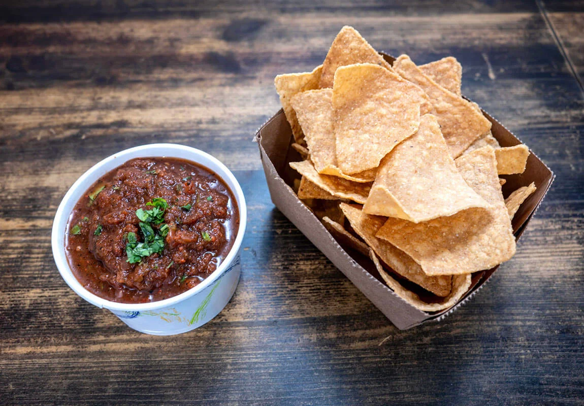 Bowl of Mexican salsa with tortilla chips