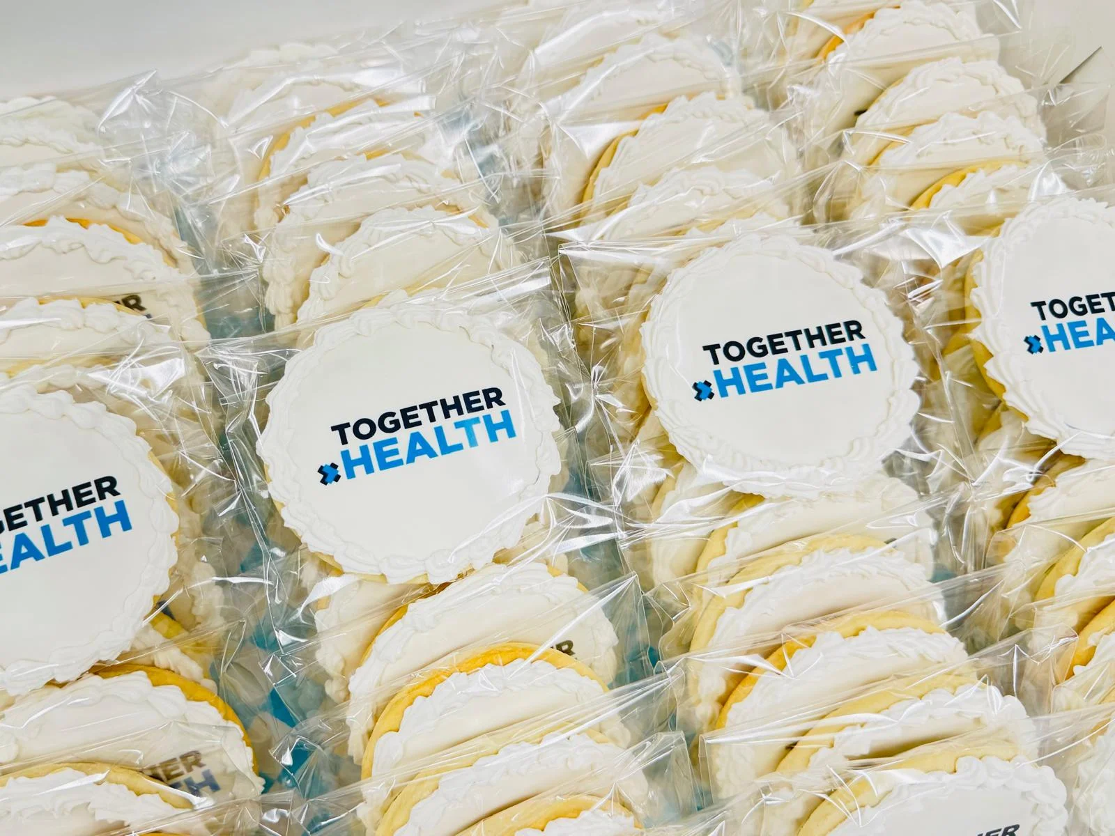 Decorative cookies with 'Together Health' branding