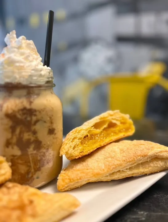 Delicious pumpkin empanadas with whipped cream drink