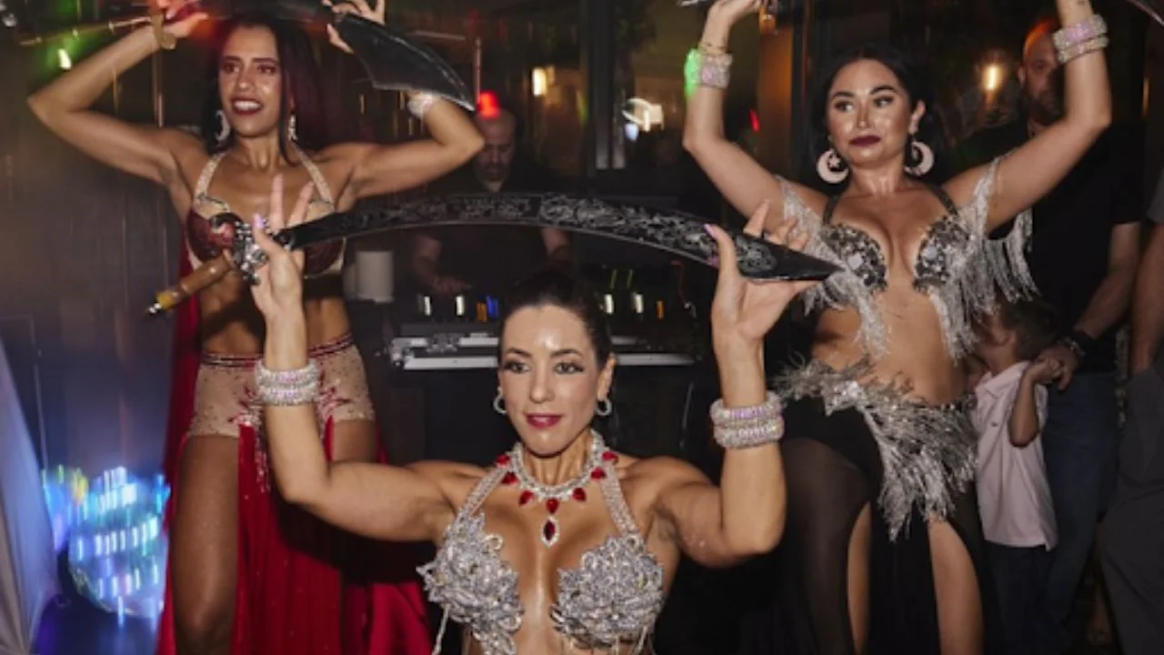 Dancers performing traditional Middle Eastern dance with swords