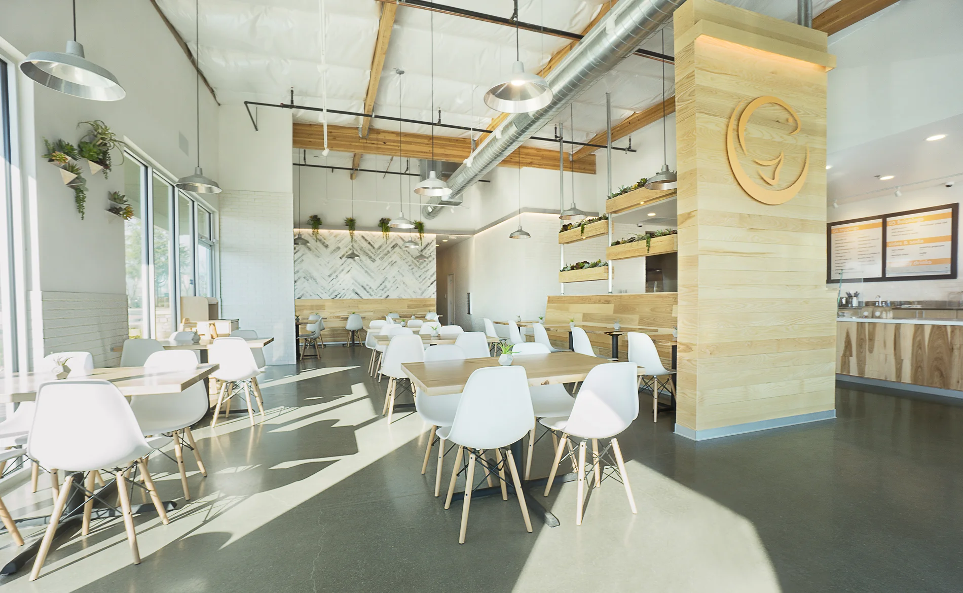 Modern restaurant interior with wooden accents and bright lighting