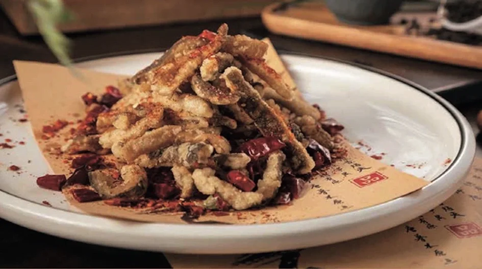 Crispy Sichuan-style fried fish with chili peppers