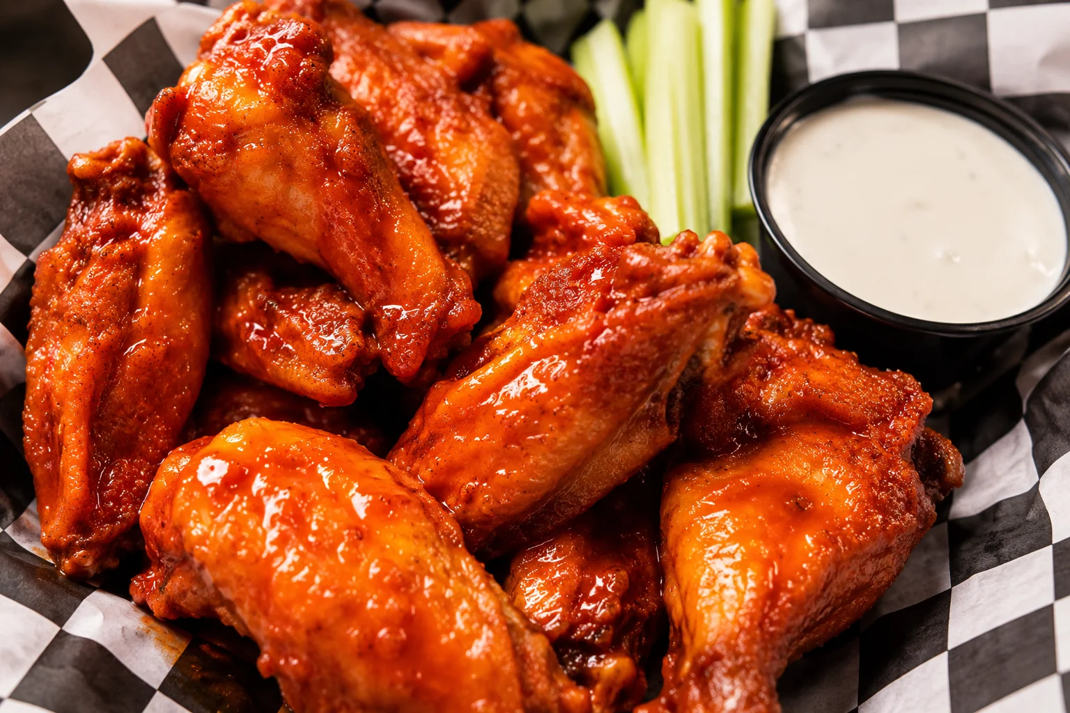 Crispy buffalo chicken wings with celery and ranch dressing