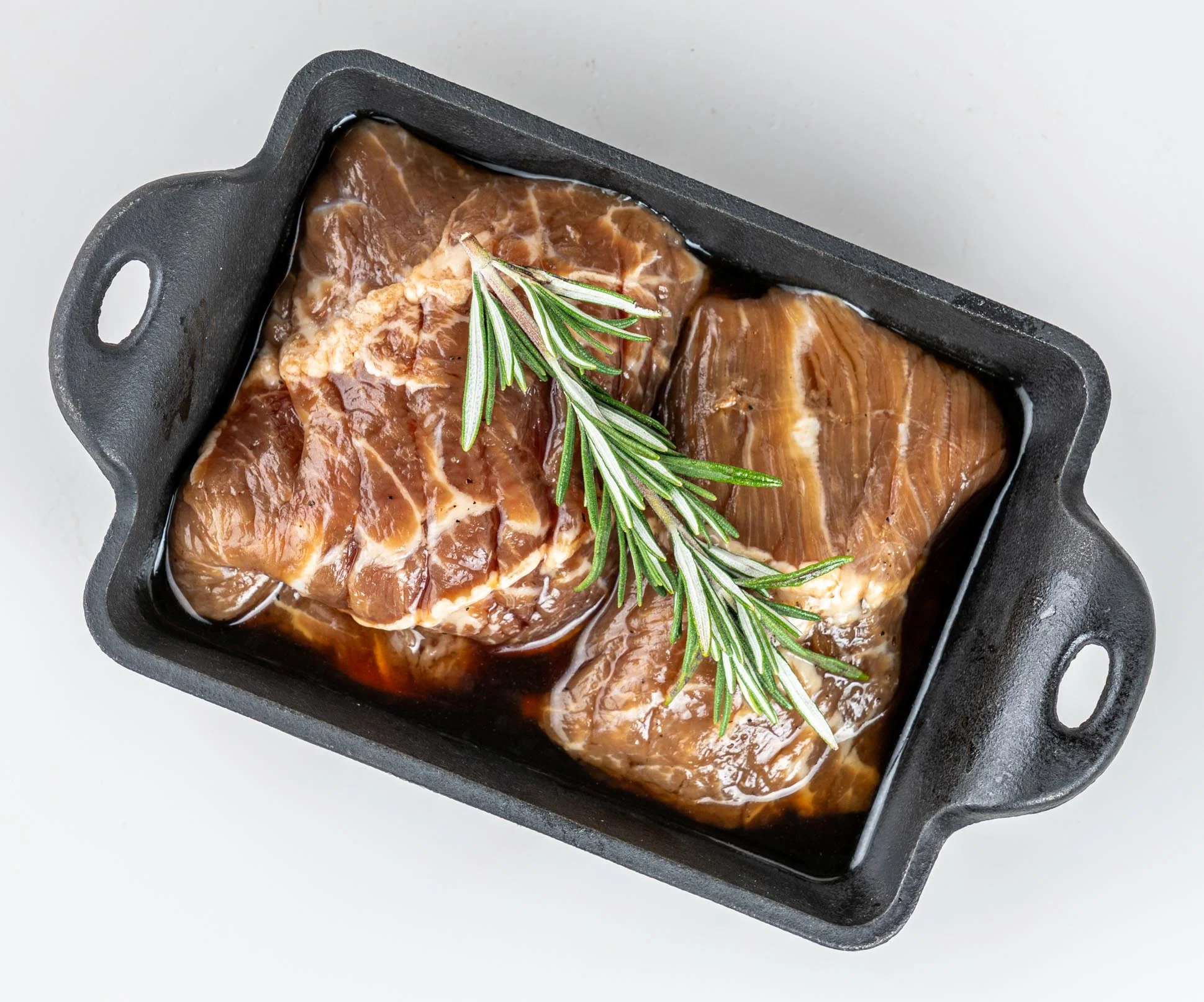 Marinated beef for Korean barbecue in a cast iron dish
