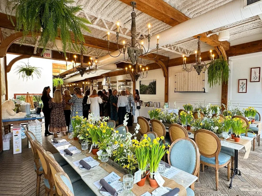 Charming restaurant interior with floral decor and warm lighting